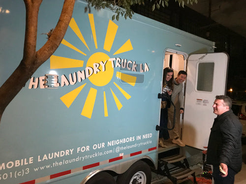 (2019) California Apparel News “Dolan Brand’s Laundry Truck LA Hits the Streets”. Photo by Andrew Asch/California Apparel News.